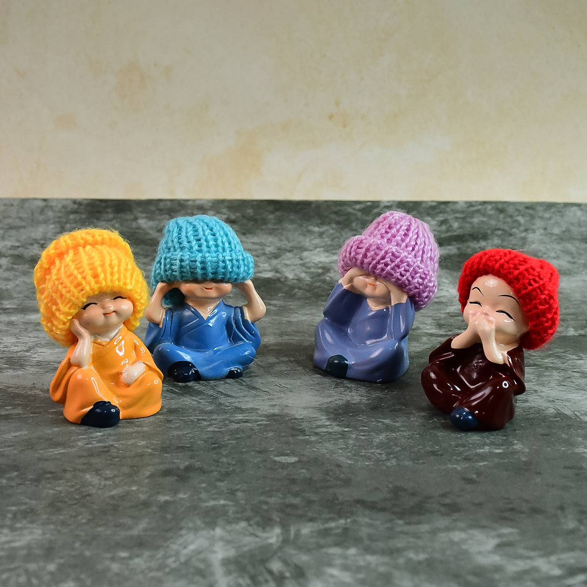 Decorative Resin Monk Buddha Showpiece Set Of 4 With Traditional Straw Hats